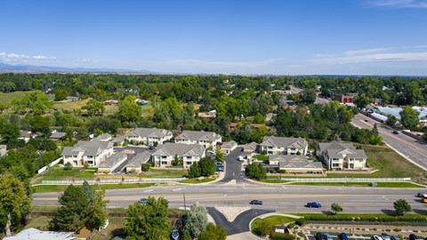 A suburban neighborhood with houses and a roundabout.