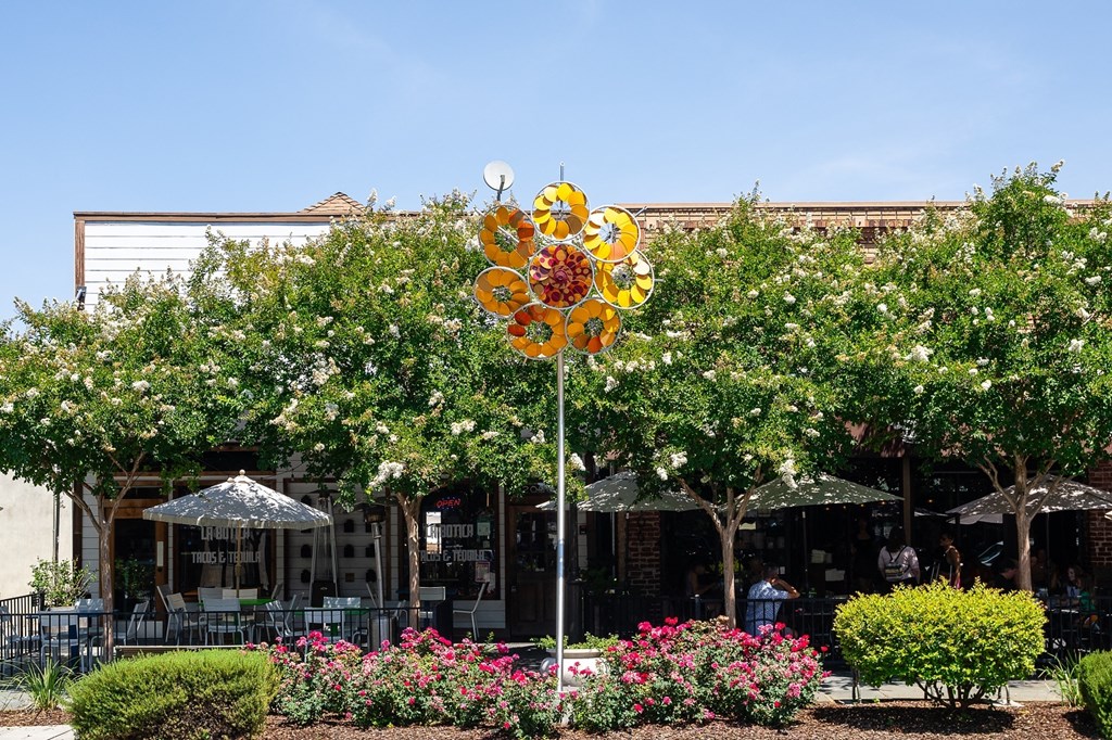 a large yellow and red sign in front of a building