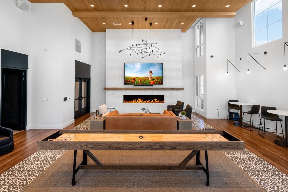 clubroom with couch and shuffleboard