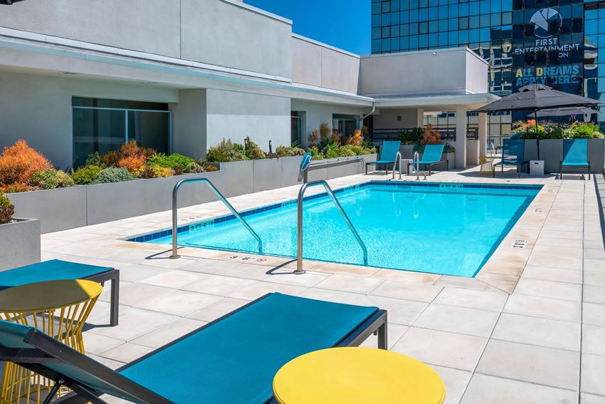 Metwest outdoor pool lounge on a sunny day. - Photo Gallery 1
