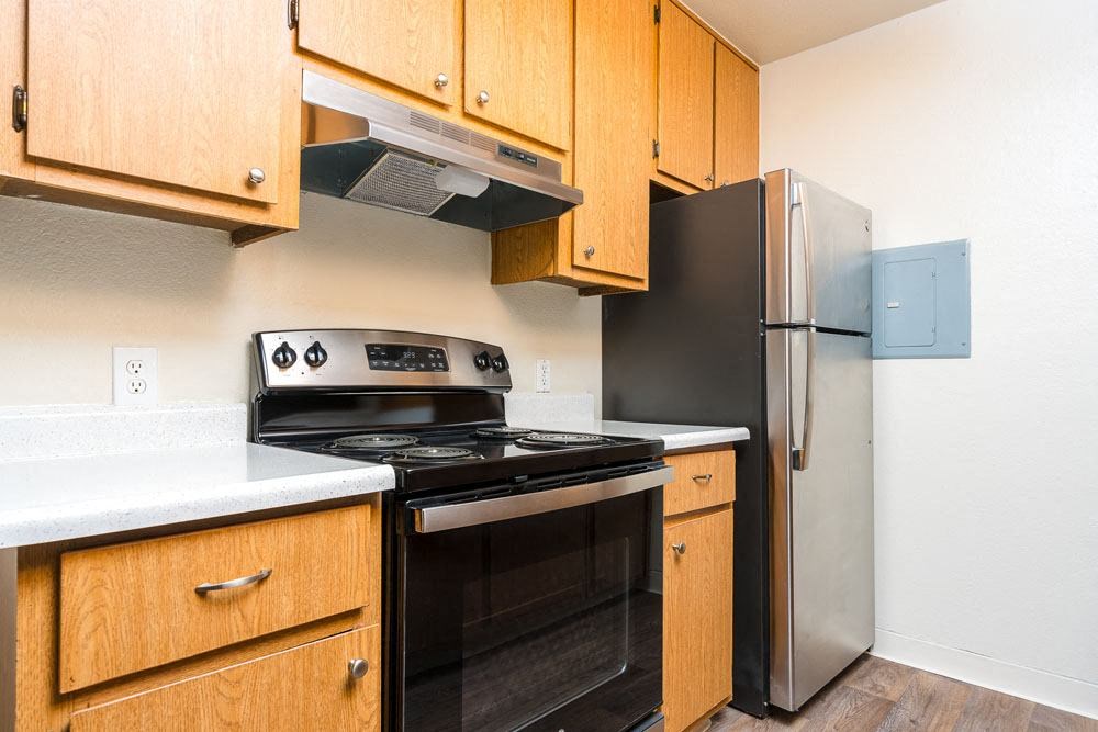 a kitchen with a stove and a refrigerator