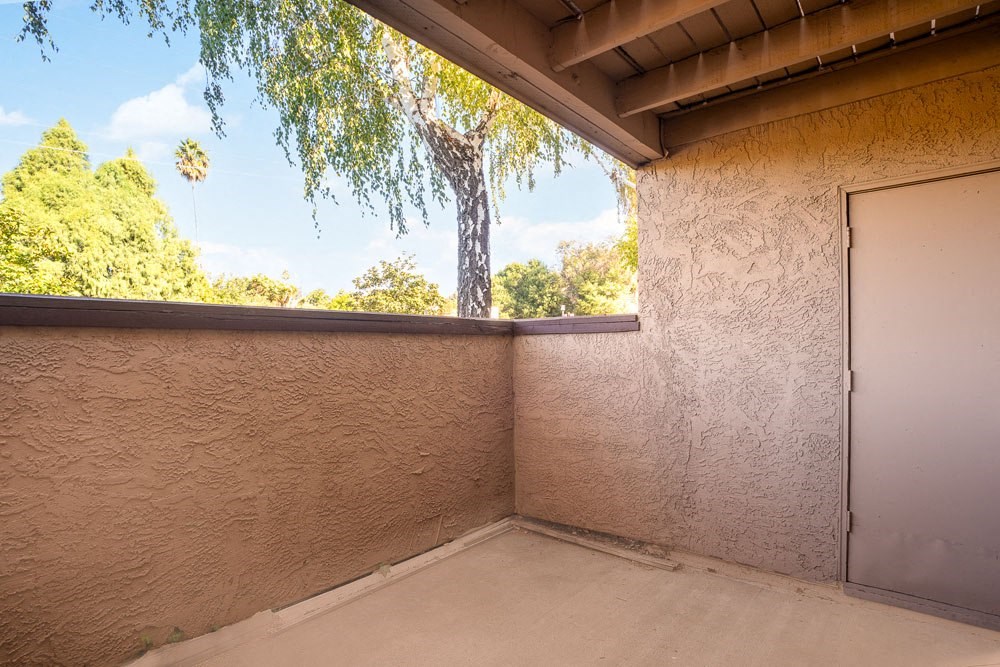 a large room with a window and a door