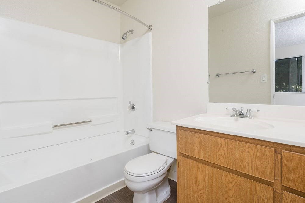 a bathroom with a toilet and a sink