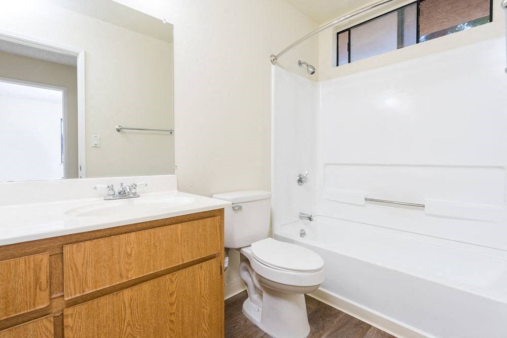 a bathroom with a sink toilet and a bath tub