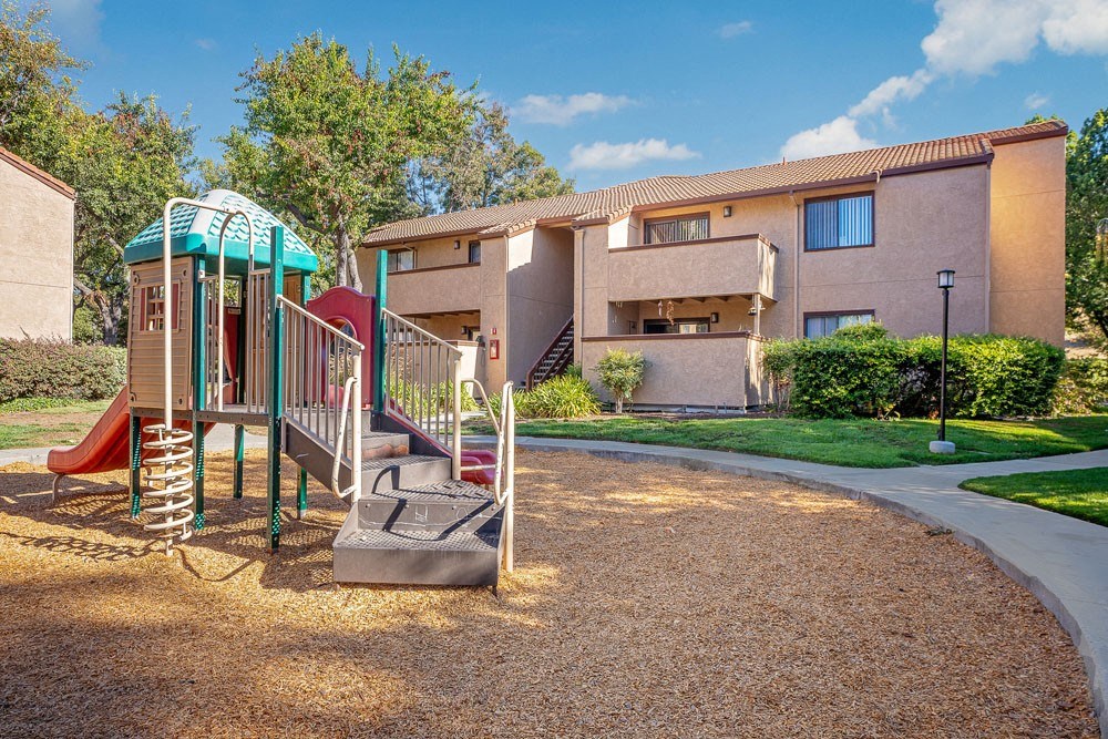 our apartments have a playground with a slide and playset
