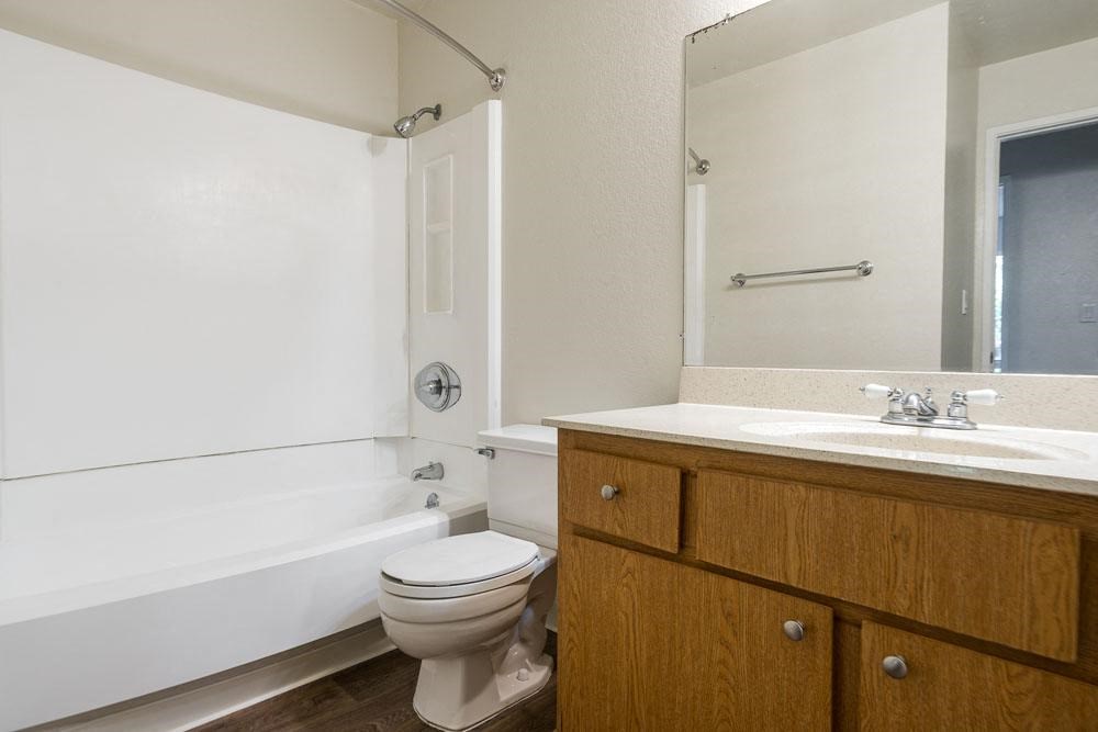 a bathroom with a sink toilet and a bath tub