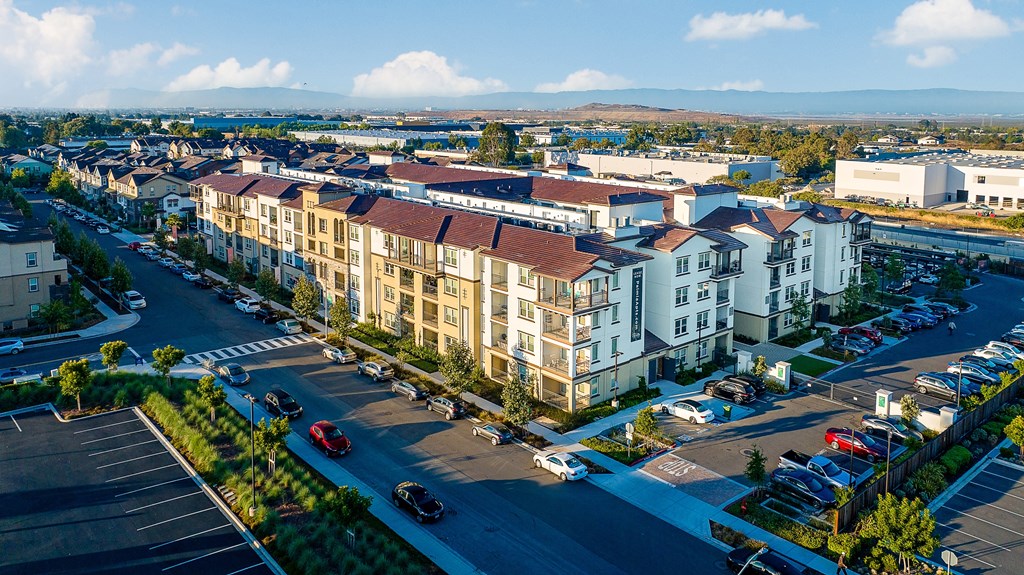 an aerial view of apartment buildings on a city street