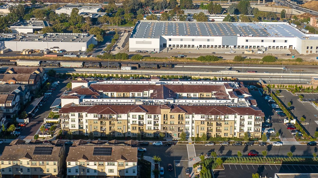an aerial view of a city with buildings and a parking lot