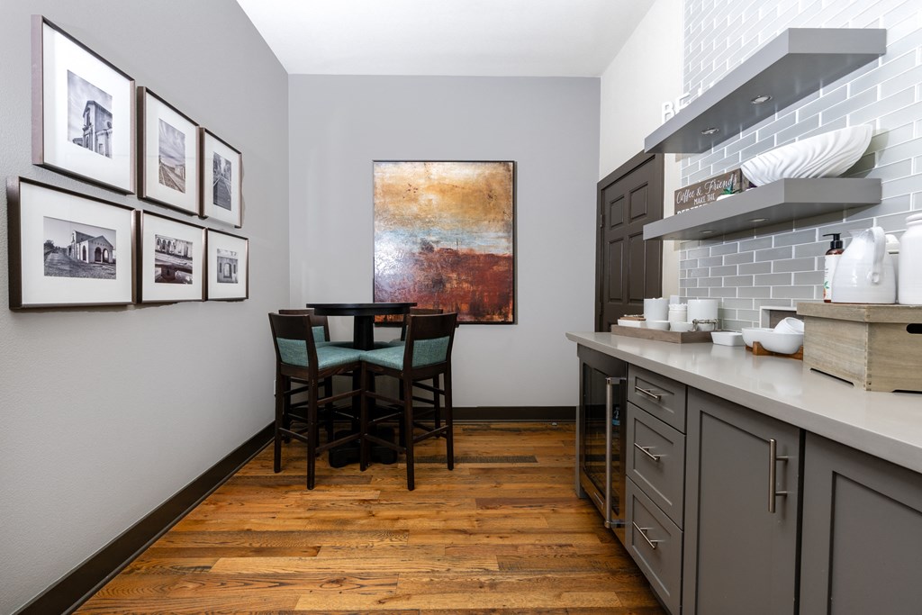 a dining room with a table and chairs in a kitchen