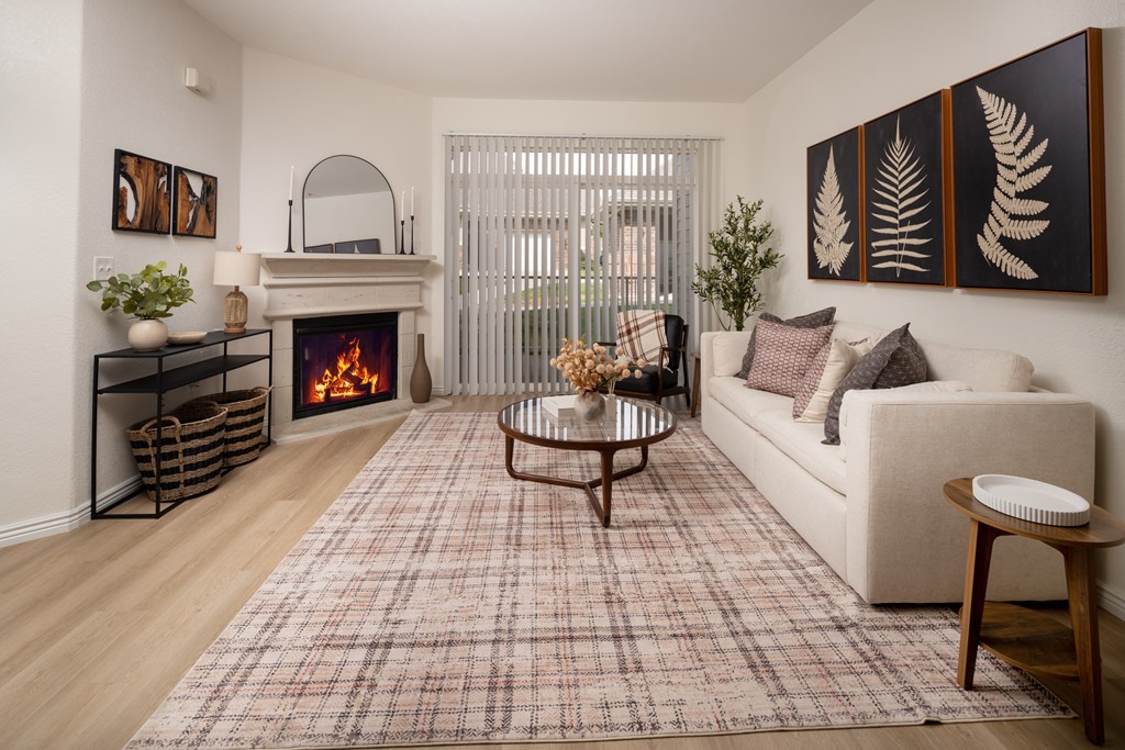 A living room with a fireplace and a couch.