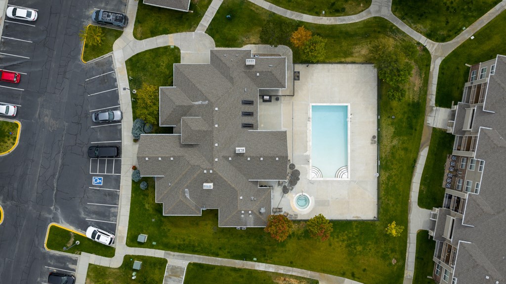 A large building with a pool in the middle of it.