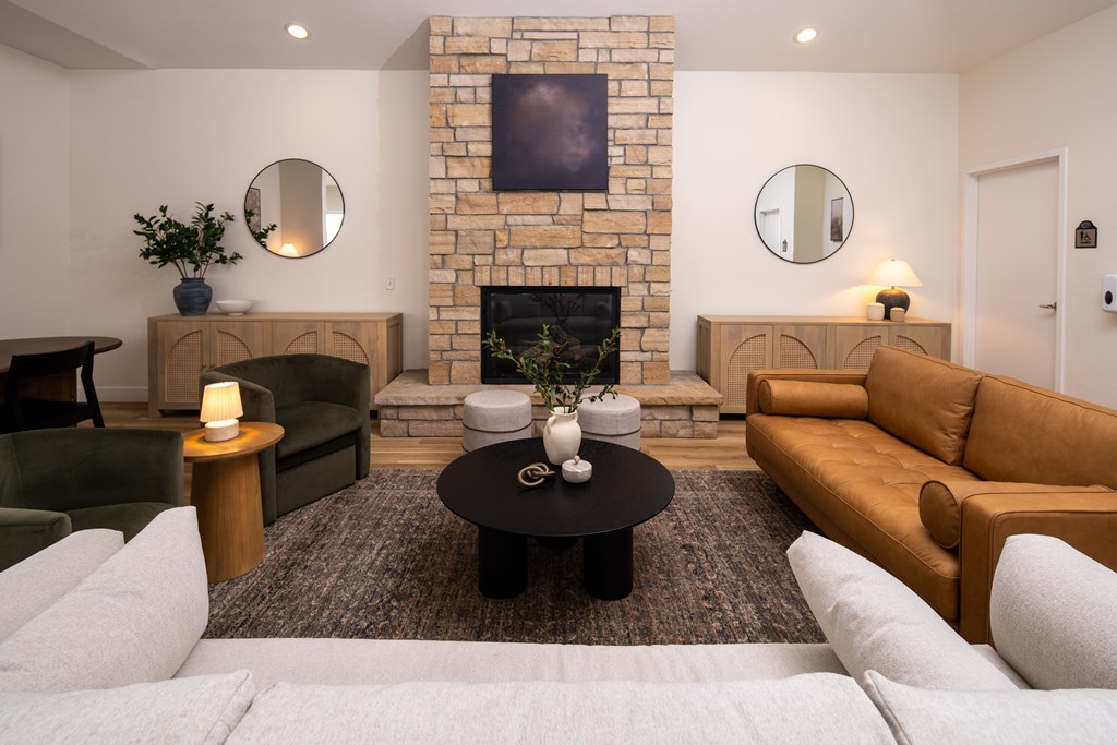 A living room with a fireplace and a couch.