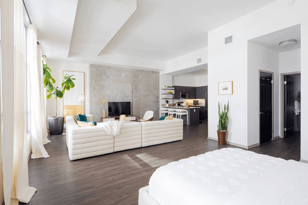 a living room with a couch and a bed