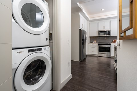 A Whirlpool washing machine is in a laundry room.