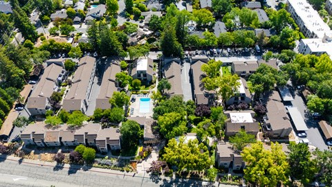 A bird's eye view of a residential area with houses and trees.