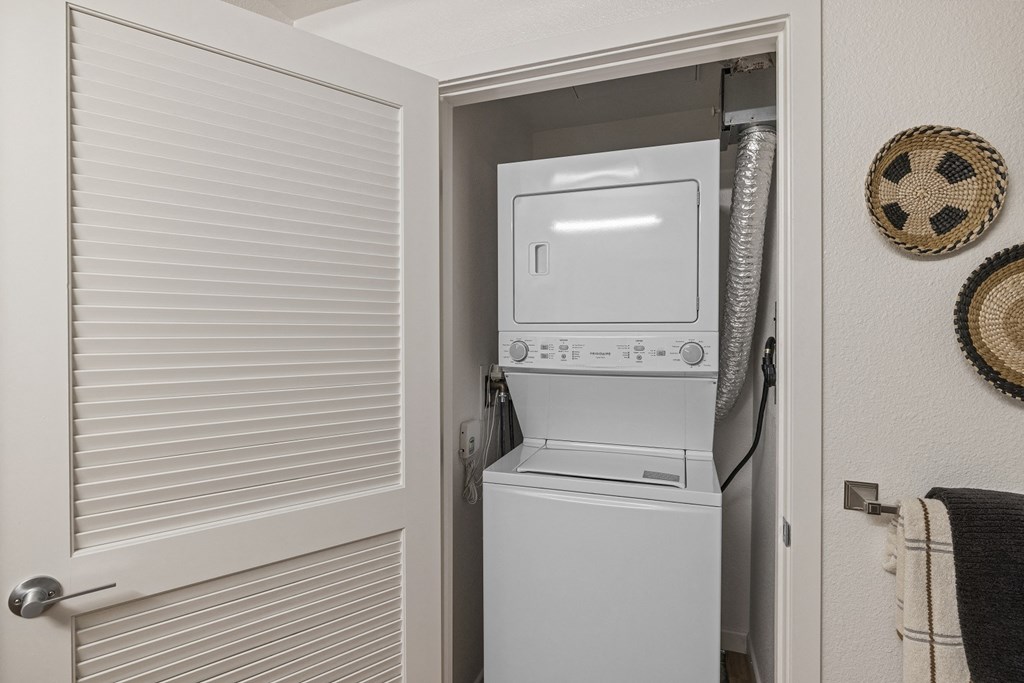 The Edge Milpitas CA a washer and dryer in the laundry room of a manufactured home