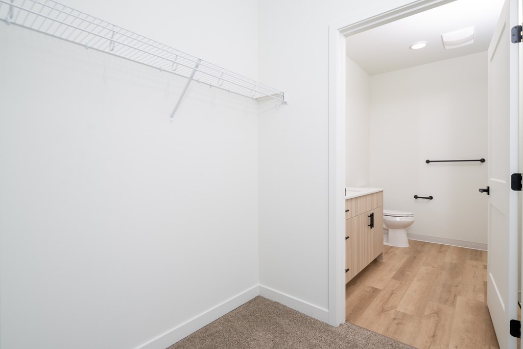 A white bathroom with a toilet and a sink.