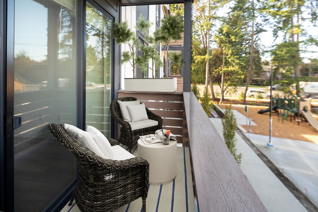 A patio with a chair and table is shown.