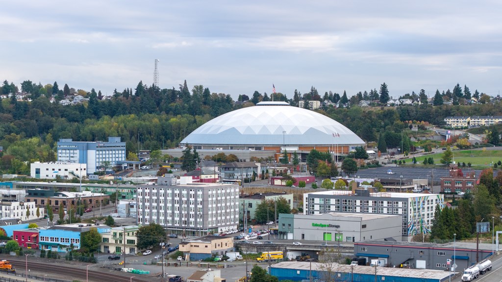 A cityscape with a large white dome-like structure in the center.