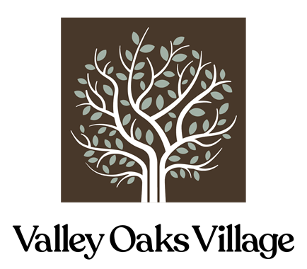 A logo with a tree and the words "Valley Oaks Village" below it.