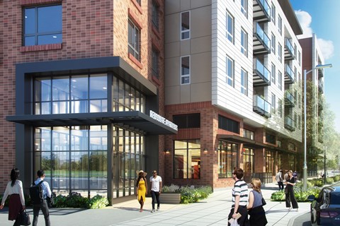 A modern building with people walking in front.