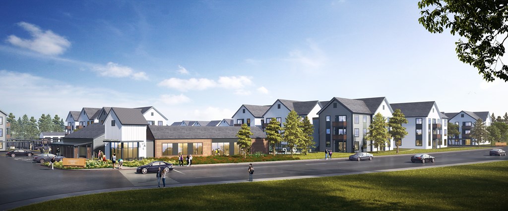 A row of modern houses with a clear blue sky above them.