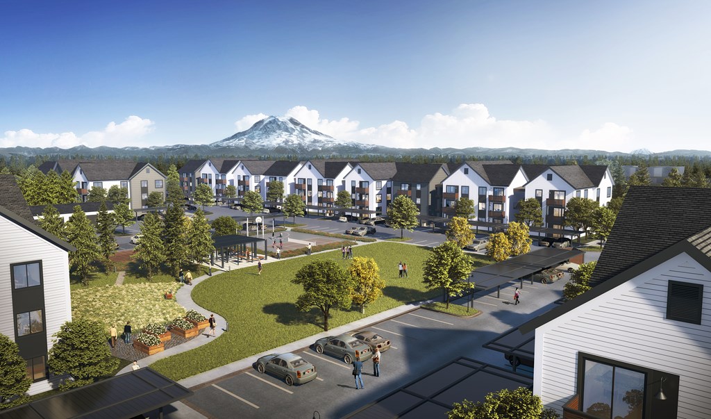 A residential area with houses and a mountain in the background.
