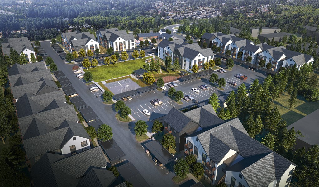 A bird's eye view of a residential area with houses and a parking lot.