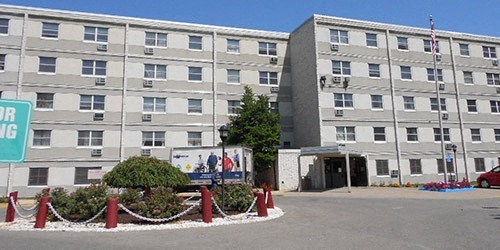 a large building with a truck parked in front of it