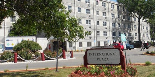 a sign for the international plaza in front of a building