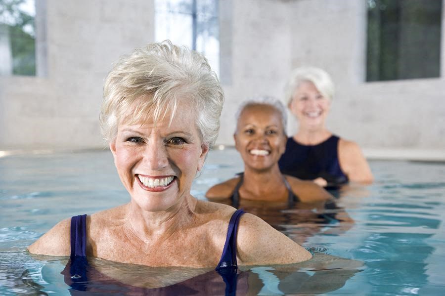 three older women in a swimming pool