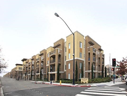 a street corner with a street light and some buildings