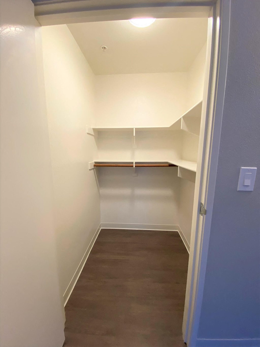 a room with white walls and a wood floor