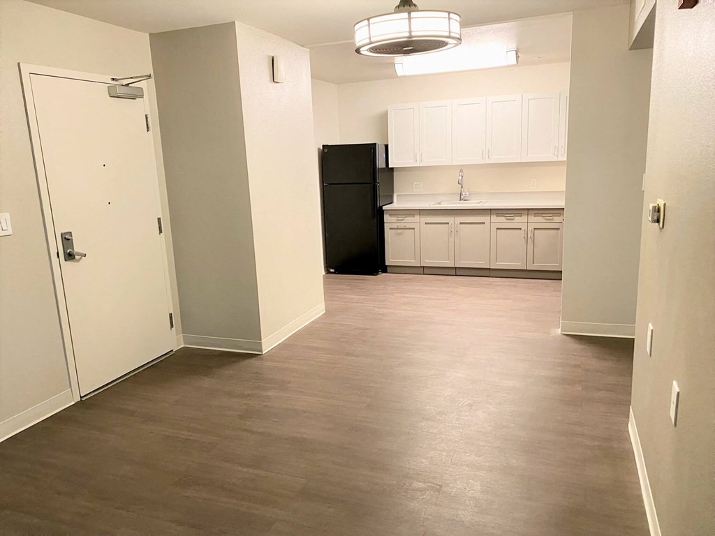 a view of a kitchen from the living room