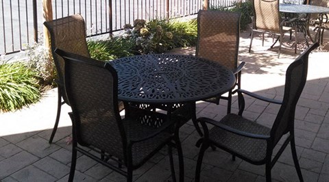 a table and chairs on a patio