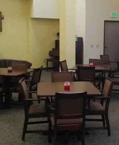 a group of tables and chairs in a room