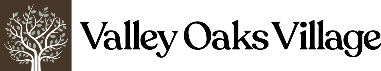 the logo for valley clash with a tree on a green background