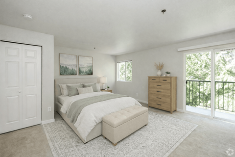 A bedroom with a large bed and a dresser.