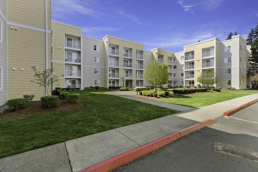 a view of the exterior of a building at the whispering winds apartments in pearland, tx a view of the exterior of a building at the whispering winds apartments in pearland, tx at Camelot Apartment Homes, Everett, 98204 - Photo Gallery