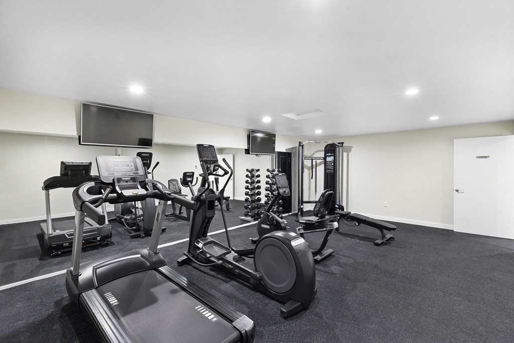 a gym with cardio equipment and a mirrored wall at Casa Blanca Apartment Homes, Everett, 98204