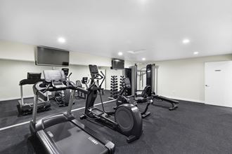 a gym with cardio equipment and mirrored wall a gym with cardio equipment and a mirrored wall at Casa Blanca Apartment Homes, Everett, 98204 - Photo Gallery