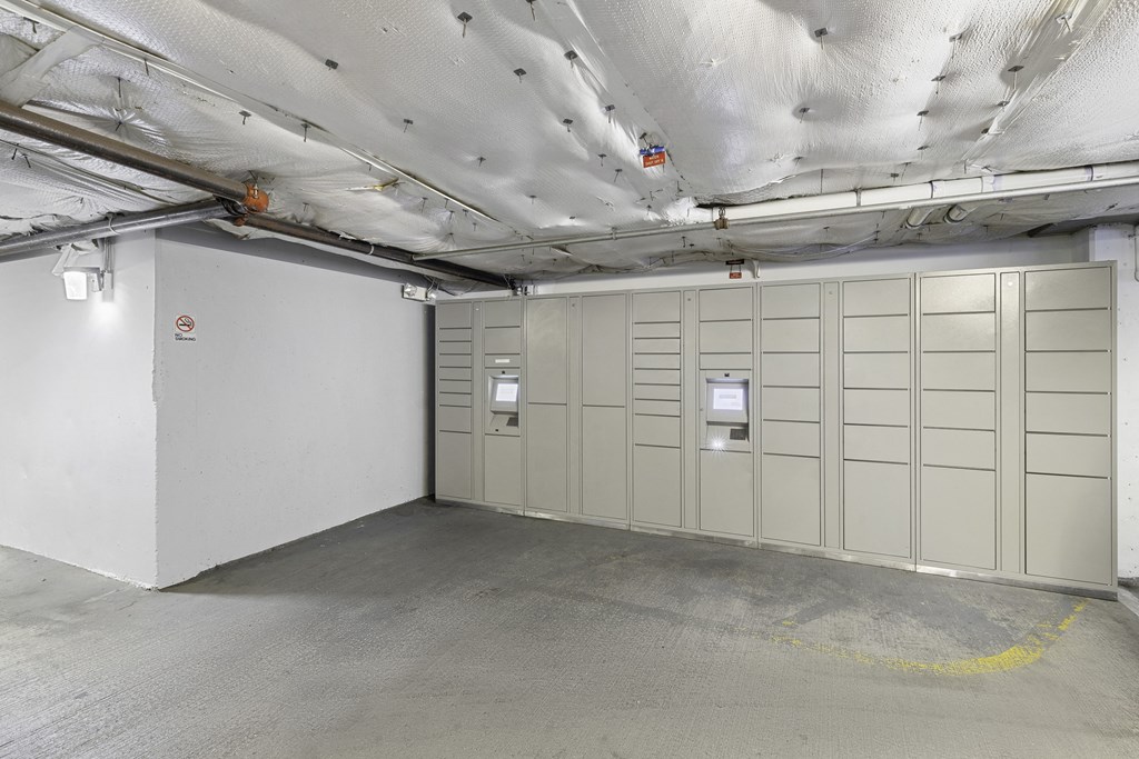 a large room with package receiving lockers  at King Arthurs Court, Seattle, 98125