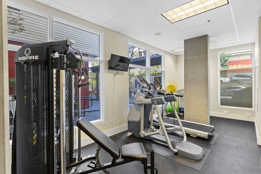 Fitness Facility with exercise equipment and windows facing outdoor view at Promenade at the Park Apartment Homes, Washington