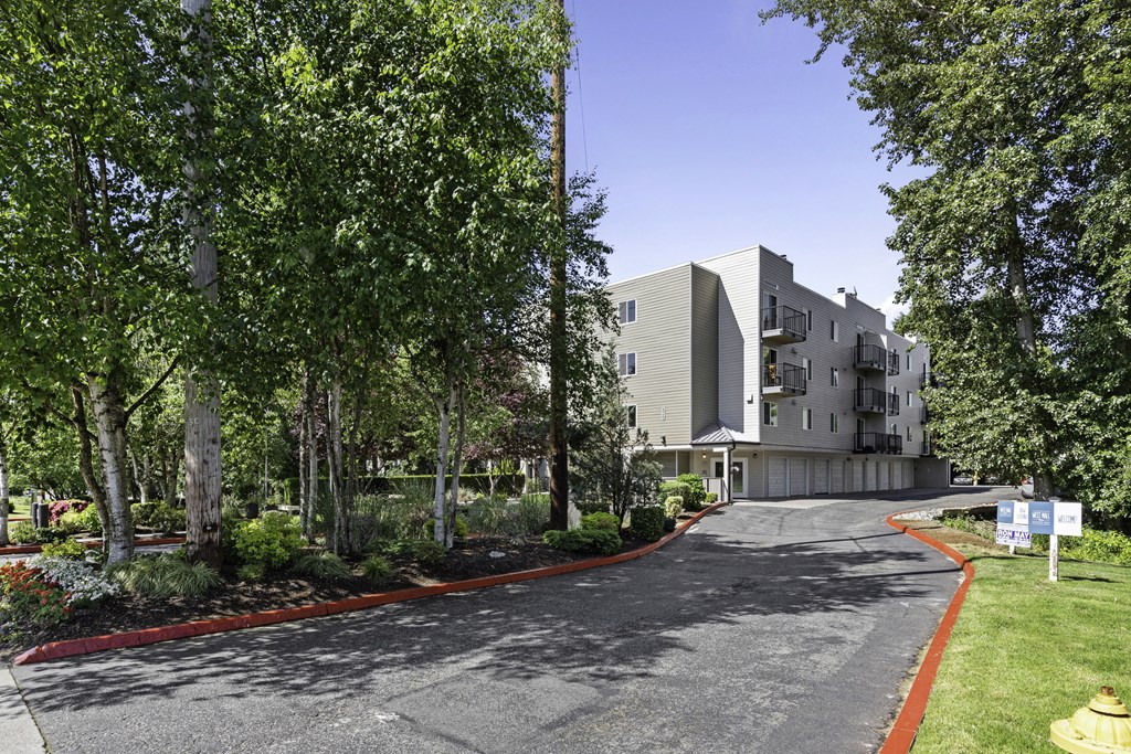 View from afar of property  building from the street at West Mall Place Apartment Homes, Washington, 98208