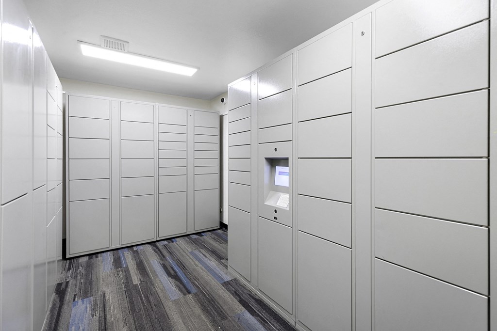 a row of white package receiving lockers at Willows Court Apartment Homes, Seattle
