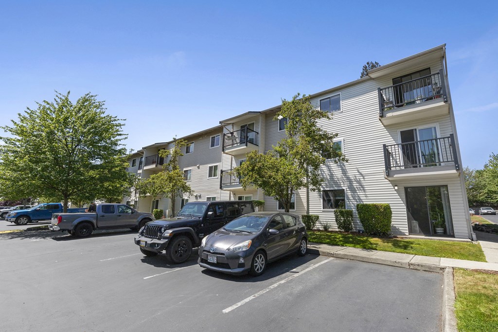 Resident parking lot in front of property building at Park Edmonds Apartment Homes, Edmonds, WA