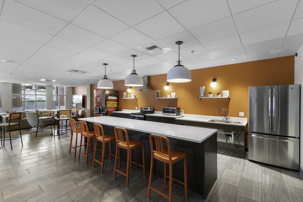 Resident Shared Kitchen Space with a long counter and chairs at Sedona Apartments, Seattle, WA