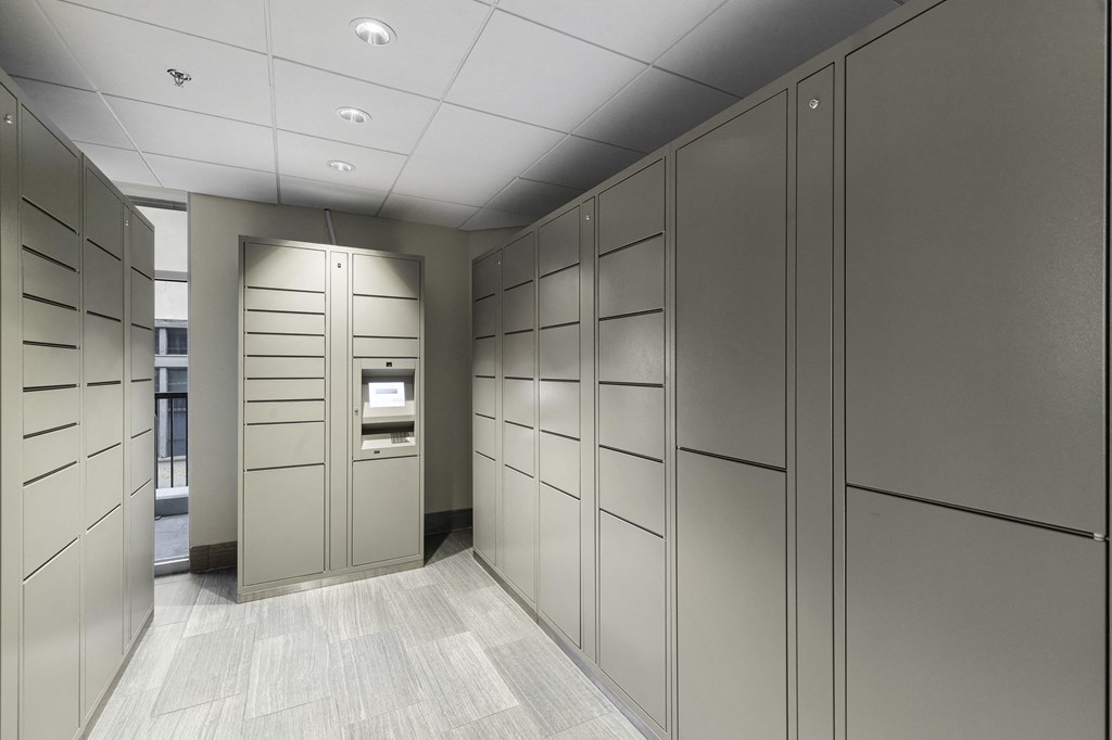 a row of gray package receiving lockers at Sedona Apartments, Seattle, 98115