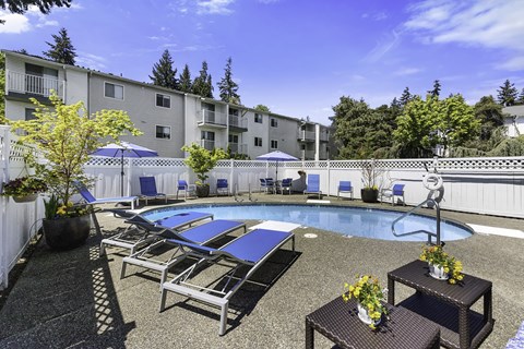 Pool With Lounge Chairs at Park 212 Apartment Homes, Edmonds, Washington