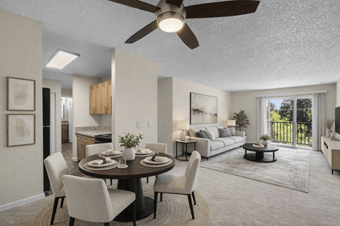 A modern dining room with a round table and chairs.